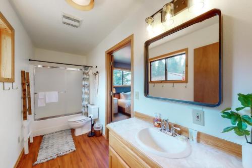 a bathroom with a sink and a mirror at Lakeside Landing in Hope
