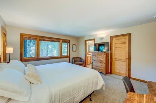 a bedroom with a large white bed and a dresser at Incline Escape in Incline Village