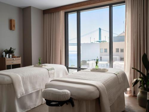 a hospital room with two beds and a large window at 1 Hotel San Francisco in San Francisco