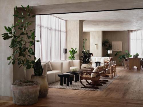 a living room with a couch and chairs and a table at 1 Hotel San Francisco in San Francisco