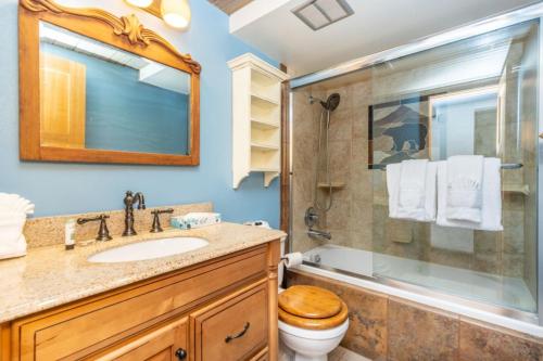 a bathroom with a sink and a shower and a toilet at Silver Queen West, Building B, Unit 7137 by Summit County Mountain Retreats in Silverthorne