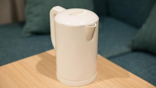 a white object sitting on top of a table at JR East Hotel Mets Premier Tokyo Bay Shinkiba in Tokyo