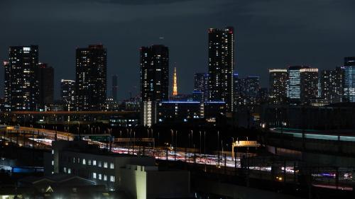 a view of a city at night with at JR East Hotel Mets Premier Tokyo Bay Shinkiba in Tokyo