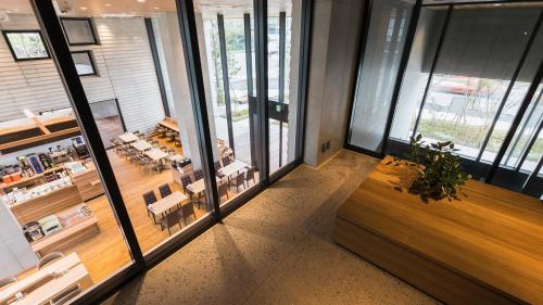 a view of a restaurant with tables and chairs at JR East Hotel Mets Premier Tokyo Bay Shinkiba in Tokyo