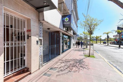 a sidewalk in front of a store on a street at La casa de tigre Centro in Tigre