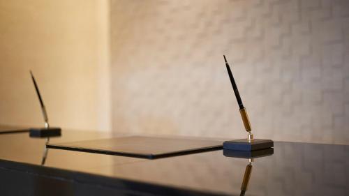 a table with two scissors on top of it at JR-East Hotel Mets Yokohama Tsurumi in Yokohama