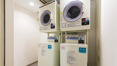 a row of washing machines in a room at JR-East Hotel Mets Yokohama Tsurumi in Yokohama
