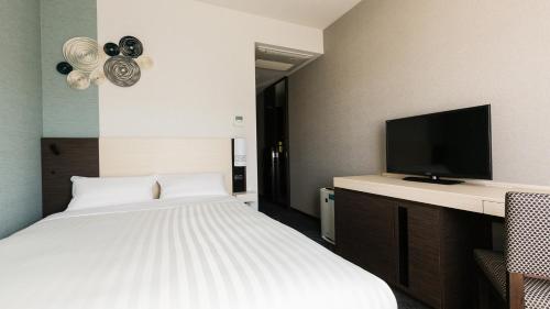 TV a/nebo společenská místnost v ubytování JR-East Hotel Mets Mizonokuchi