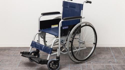 a blue wheelchair sitting against a white wall at JR-East Hotel Mets Mizonokuchi in Kawasaki