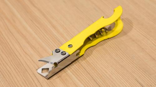 a yellow knife sitting on top of a wooden table at JR-East Hotel Mets Urawa in Saitama