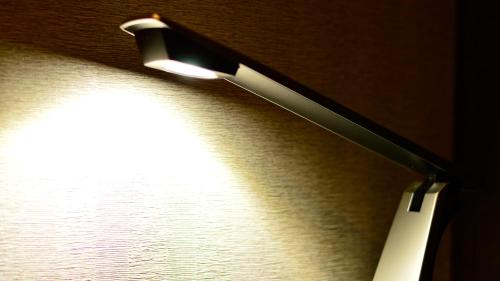 a light shining on a wall with a drawer at JR-East Hotel Mets Urawa in Saitama