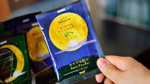 a person holding a book in their hand at JR-East Hotel Mets Tsudanuma in Narashino