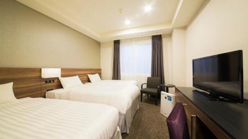 TV a/nebo společenská místnost v ubytování JR-East Hotel Mets Mito