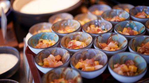 a bunch of cups filled with food on a table at JR East Hotel Mets Premier Sapporo in Sapporo