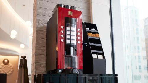a red and black appliance sitting on top of a table at JR East Hotel Mets Premier Sapporo in Sapporo