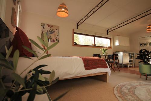 Ένα ή περισσότερα κρεβάτια σε δωμάτιο στο Stoney Creek Cottage