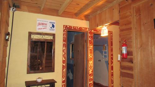 a room with a door and a mirror on a wall at Centro Ecológico Montaña Verde in Rivas