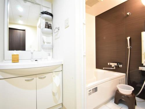 a bathroom with a sink and a toilet and a tub at Regariain - Vacation STAY 85013 in Okayama