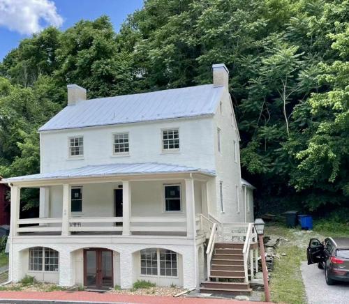 a white house with a metal roof at 1799 Inn Harpers Ferry in Harpers Ferry