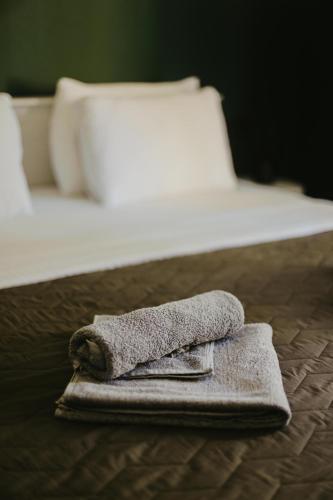 a towel sitting on top of a bed at Jungle Soul in Mirissa