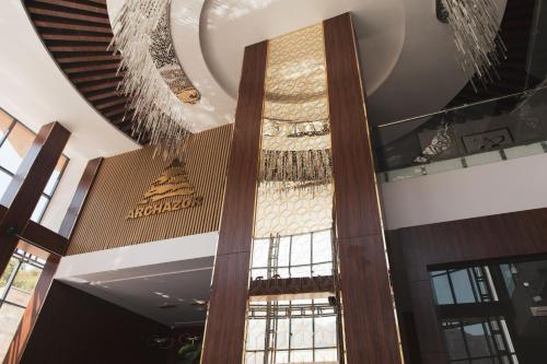 a building with a ceiling with a chandelier at ARCHAZOR Mountain Resort in Chimgan