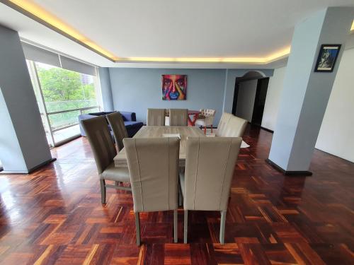 a dining room with a table and chairs at Luxury Apartment Masaryk 4BR in Mexico City