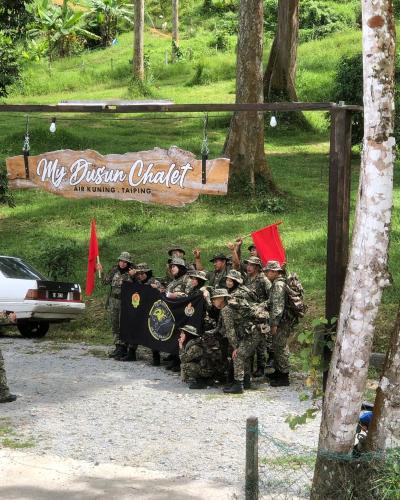 a group of soldiers in military uniforms posing for a picture at MyDusun Chalet, Taiping, Perak, Malaysia in Taiping