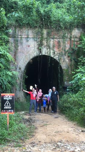 a group of people standing inside of a tunnel at MyDusun Chalet, Taiping, Perak, Malaysia in Taiping