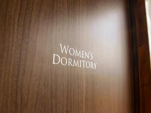 a door with a sign that reads womens donation at 14 Guesthouse Mt.Fuji in Fuji