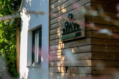 a sign on the side of a building at Kikapcsol-LAK in Bogács