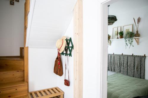 a room with a door leading into a bedroom at Kikapcsol-LAK in Bogács