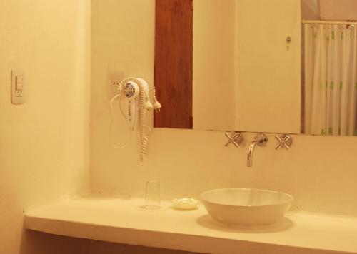 a bathroom with a sink with a bowl on the counter at Cabañas Donkaia in La Población