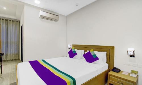 Letto o letti in una camera di Treebo Premium Brijinn