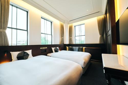 Llit o llits en una habitació de OMO5 Otaru by Hoshino Resorts