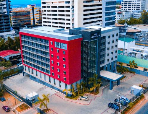 an overhead view of a red building in a city at Crowne Plaza - Dar Es Salaam by IHG in Dar es Salaam