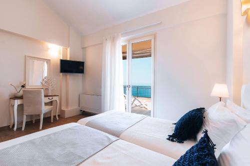 Ένα ή περισσότερα κρεβάτια σε δωμάτιο στο Villa Omikron