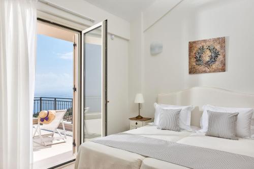 Ένα ή περισσότερα κρεβάτια σε δωμάτιο στο Villa Omikron