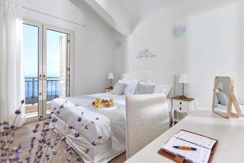 Ένα ή περισσότερα κρεβάτια σε δωμάτιο στο Villa Omikron