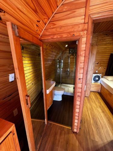 a bathroom with a toilet and a tub in a room at HB Bungalow in Da Lat