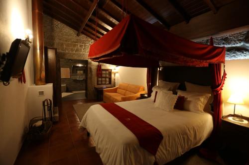 מיטה או מיטות בחדר ב-Casas do Rio