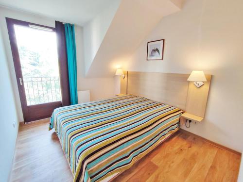 Posteľ alebo postele v izbe v ubytovaní Le Flocon, T2, wifi, vue montagne, parking gratuit, 4 personnes