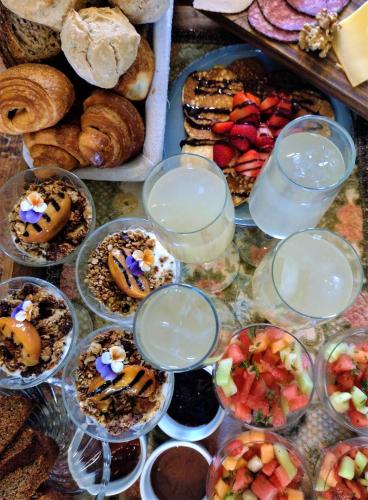 a table topped with lots of different types of pastries at Wetterdelle Lodge in Heers