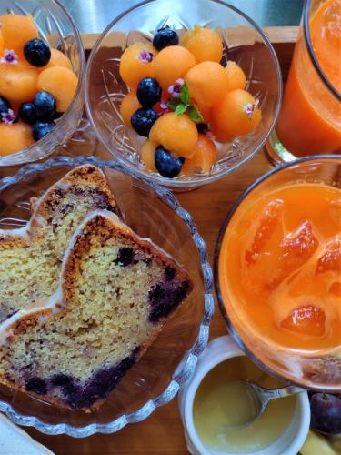 a table topped with bowls of bread and fruit at Wetterdelle in Heers