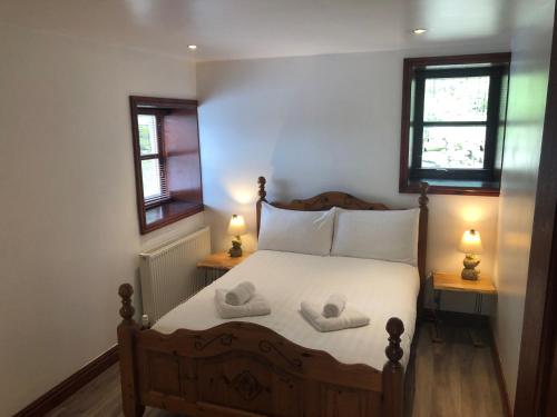 Katil atau katil-katil dalam bilik di Maberry Cottage