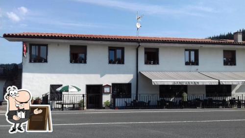 a building with a cartoon character on the side of the street at Agroturismo Erlete Goikoa -ESTAMOS EN EL CAMINO DE SANTIAGO -WE ARE ON THE CAMINO DE SANTIAGO in Deba
