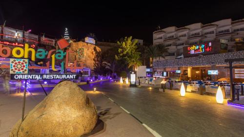 a large rock on the side of a street at night at Naama Bay Hotel & Resort in Sharm El Sheikh