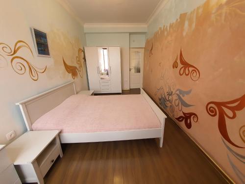 Кровать или кровати в номере De Facto home