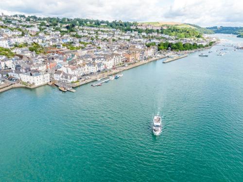 an aerial view of a boat in a body of water at Waterfront House in Dartmouth