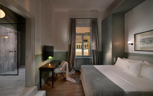 Letto o letti in una camera di ATHINAIDOS QUARTERS by K&K