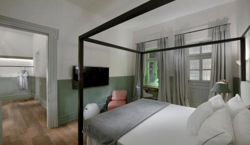 Letto o letti in una camera di ATHINAIDOS QUARTERS by K&K